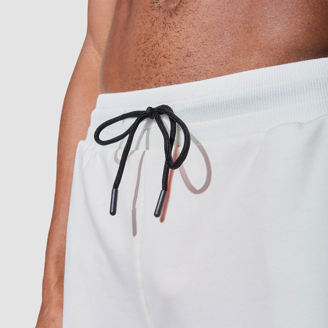 squatwolf-gym-wear-graphic-wordmark-jogger-shorts-white-workout-shorts-for-men